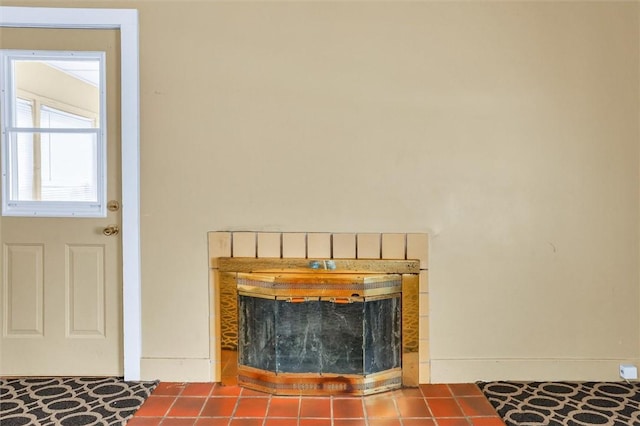 details with a tile fireplace