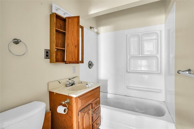 bathroom with  shower combination, vanity, and toilet