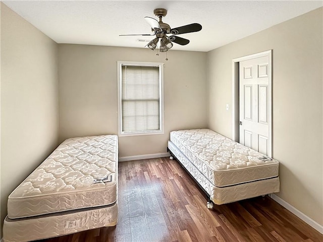 1113 Unique Ct, Mattoon, IL 61938 - bedroom with wood finished floors, baseboards, and ceiling fan