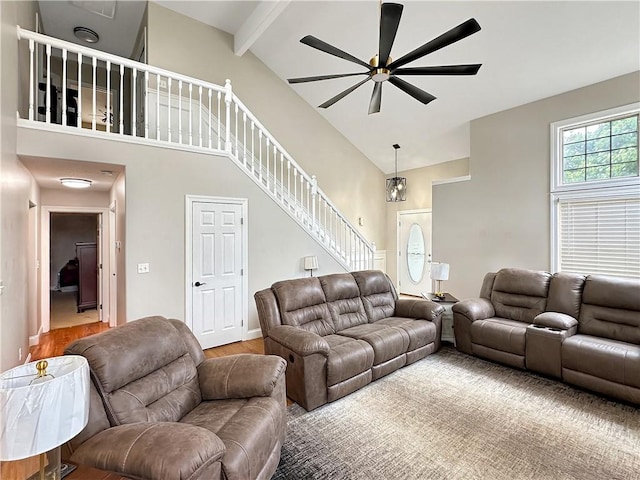 1113 Unique Ct, Mattoon, IL 61938 - living room with stairway, ceiling fan, beam ceiling, high vaulted ceiling, and wood finished floors