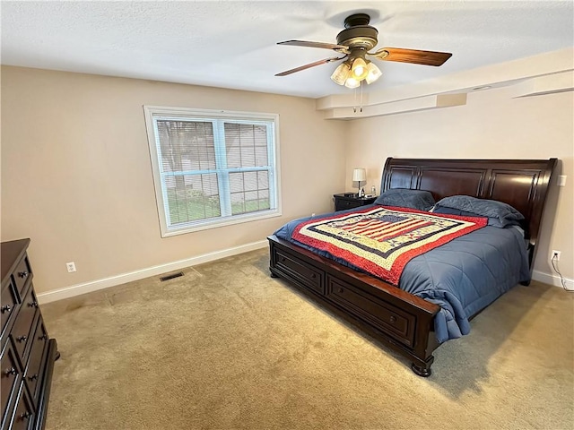 1113 Unique Ct, Mattoon, IL 61938 - bedroom with light carpet, baseboards, and ceiling fan