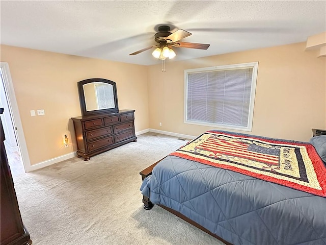 1113 Unique Ct, Mattoon, IL 61938 - bedroom with carpet floors, baseboards, a ceiling fan, and a textured ceiling