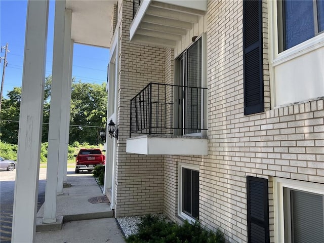 view of property exterior with brick siding