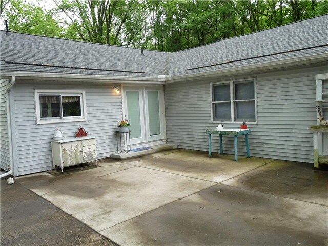 3535 Ferndale Ave, Danville, IL 61834 - back of property featuring a shingled roof and a patio area