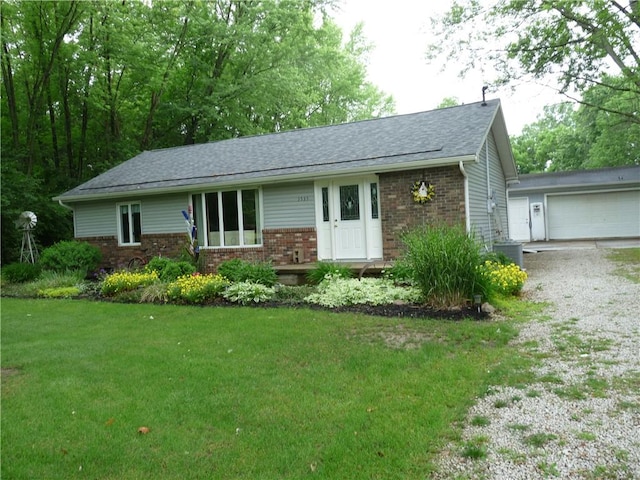 3535 Ferndale Ave, Danville, IL 61834 - ranch-style home with brick siding, a front lawn, a shingled roof, and a garage