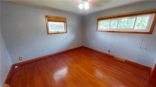 204 Bryan St, Catlin, IL 61817 - empty room featuring wood finished floors, ceiling fan, and baseboards