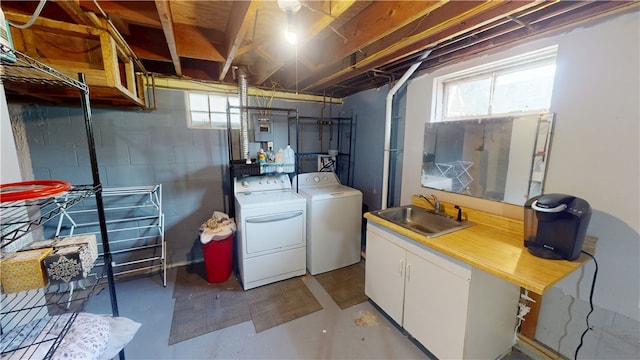 204 Bryan St, Catlin, IL 61817 - laundry area featuring washing machine and clothes dryer, cabinet space, and concrete block wall