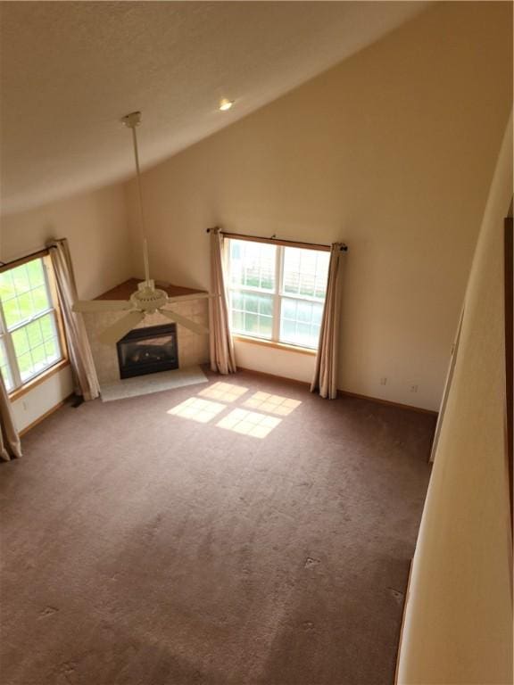 107 Edgewood Ave, Effingham, IL 62401 - unfurnished living room featuring lofted ceiling, carpet, ceiling fan, and a glass covered fireplace