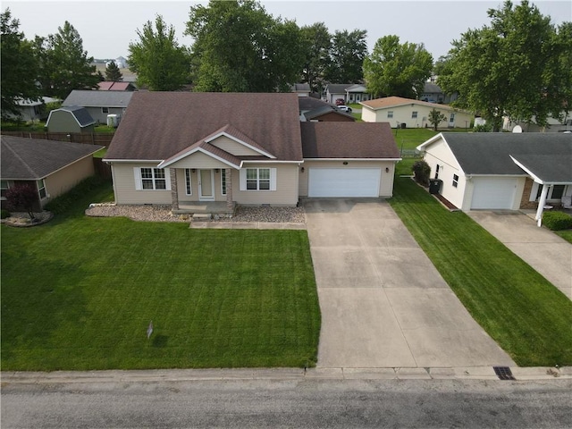 107 Edgewood Ave, Effingham, IL 62401 - ranch-style house with an attached garage, driveway, a front yard, and a residential view