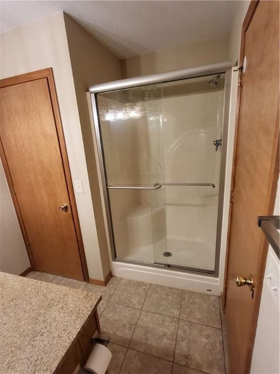 107 Edgewood Ave, Effingham, IL 62401 - bathroom featuring a shower stall, tile patterned flooring, and vanity