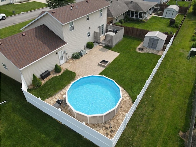 107 Edgewood Ave, Effingham, IL 62401 - view of pool with a storage unit, a fenced backyard, and a deck