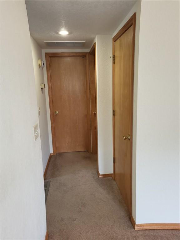 107 Edgewood Ave, Effingham, IL 62401 - hallway featuring light carpet and baseboards