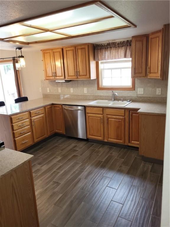 107 Edgewood Ave, Effingham, IL 62401 - kitchen featuring dishwasher, light countertops, dark wood-style flooring, and backsplash