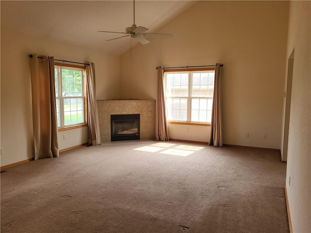 107 Edgewood Ave, Effingham, IL 62401 - unfurnished living room with carpet, a tile fireplace, ceiling fan, and high vaulted ceiling