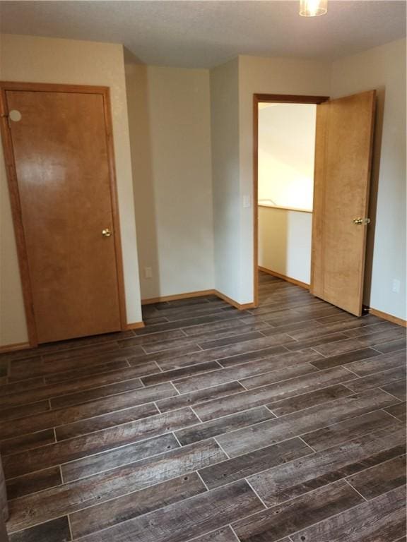 107 Edgewood Ave, Effingham, IL 62401 - unfurnished room featuring dark wood-type flooring and baseboards