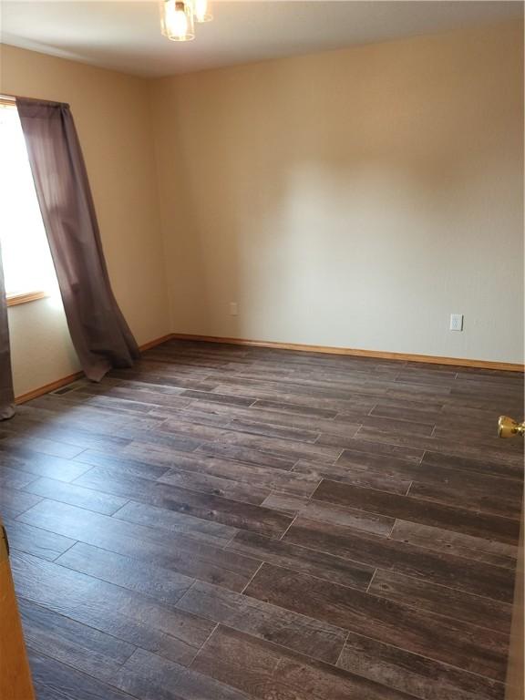 107 Edgewood Ave, Effingham, IL 62401 - unfurnished room with dark wood-style floors
