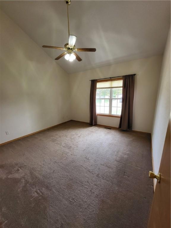 107 Edgewood Ave, Effingham, IL 62401 - empty room featuring lofted ceiling, a ceiling fan, and carpet floors