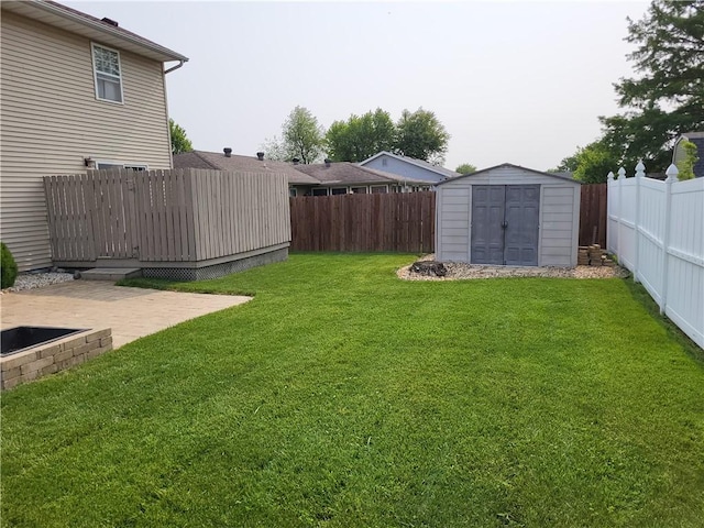 107 Edgewood Ave, Effingham, IL 62401 - fenced backyard with a storage unit and a patio