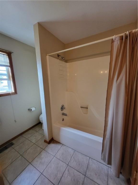 107 Edgewood Ave, Effingham, IL 62401 - full bathroom featuring shower / tub combo with curtain and tile patterned flooring