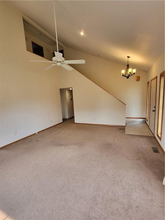 107 Edgewood Ave, Effingham, IL 62401 - unfurnished living room with vaulted ceiling, a chandelier, carpet flooring, a ceiling fan, and recessed lighting