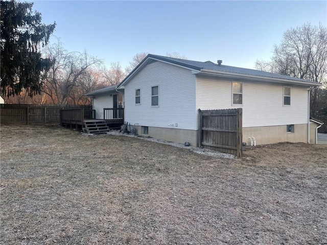 rear view of house featuring a deck