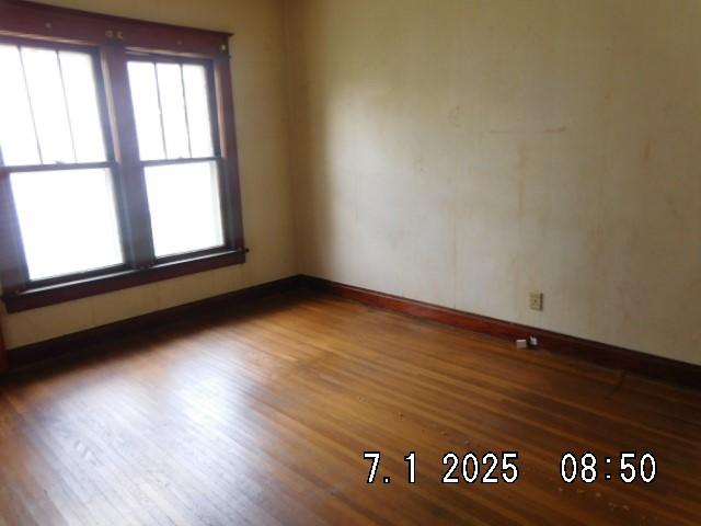 316 Plum St, Danville, IL 61832 - unfurnished room featuring wood finished floors