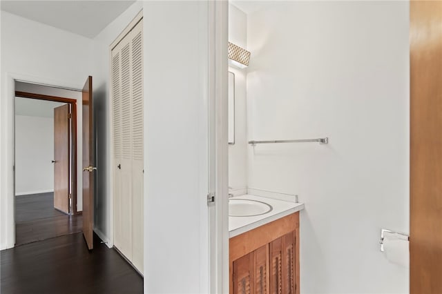 3044 Greenlake Dr, Decatur, IL 62521 - bathroom featuring vanity, wood finished floors, and a closet