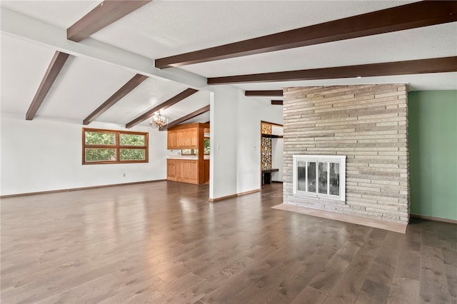 3044 Greenlake Dr, Decatur, IL 62521 - unfurnished living room featuring a chandelier, a fireplace, and wood finished floors