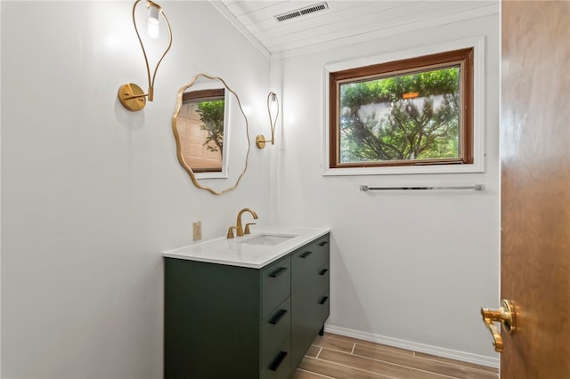 3044 Greenlake Dr, Decatur, IL 62521 - bathroom with vanity and wood finished floors