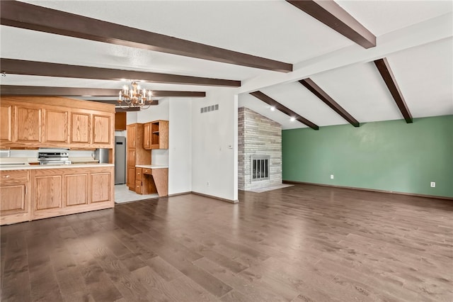3044 Greenlake Dr, Decatur, IL 62521 - unfurnished living room featuring a chandelier, dark wood-style floors, and a tile fireplace