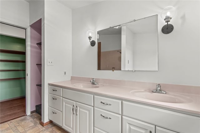 3044 Greenlake Dr, Decatur, IL 62521 - full bath with double vanity and stone tile flooring