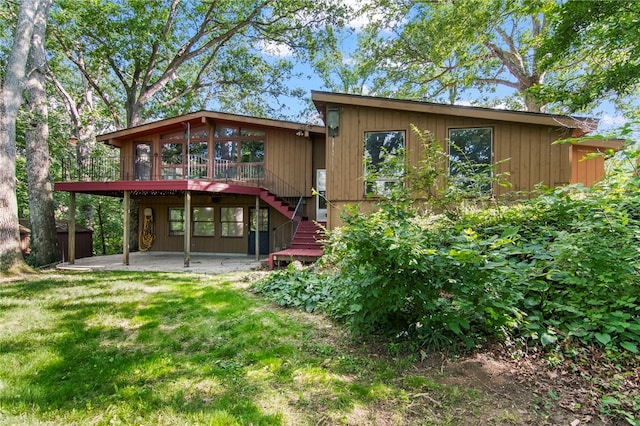 3044 Greenlake Dr, Decatur, IL 62521 - back of house featuring a patio, stairway, a wooden deck, and a lawn