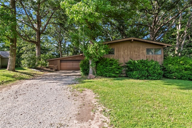 3044 Greenlake Dr, Decatur, IL 62521 - view of front of home with gravel driveway and a front yard