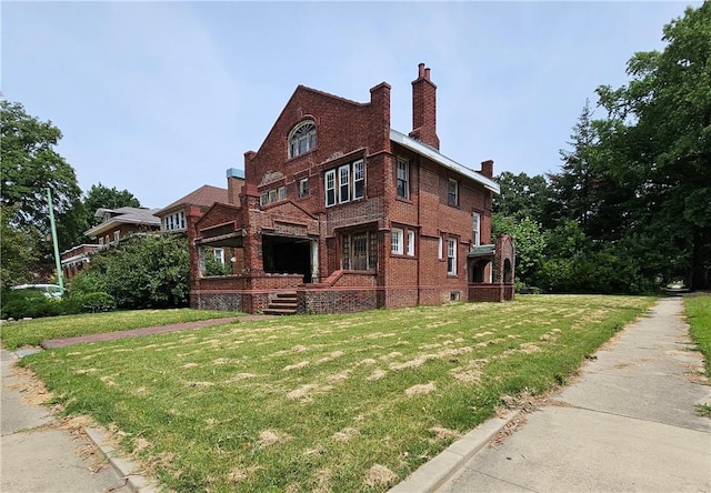 528 E Broadway St, Centralia, IL 62801 - view of side of home with brick siding, a yard, and a chimney