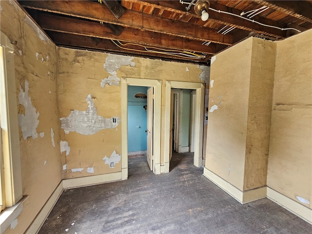 misc room featuring beamed ceiling and wooden ceiling