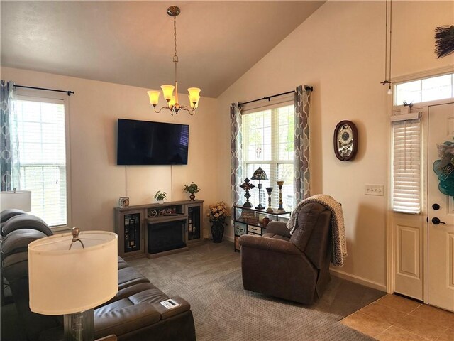 8 Courtyard Blvd, Sullivan, IL 61951 - living area featuring a chandelier, vaulted ceiling, healthy amount of natural light, baseboards, and carpet