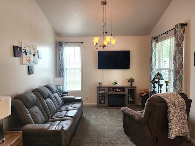 8 Courtyard Blvd, Sullivan, IL 61951 - carpeted living area with lofted ceiling, a chandelier, plenty of natural light, baseboards, and a fireplace