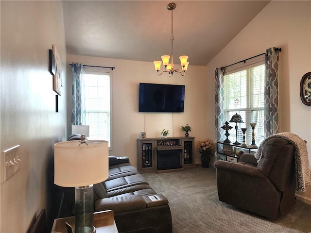 8 Courtyard Blvd, Sullivan, IL 61951 - living room featuring vaulted ceiling, carpet floors, a chandelier, healthy amount of natural light, and a fireplace