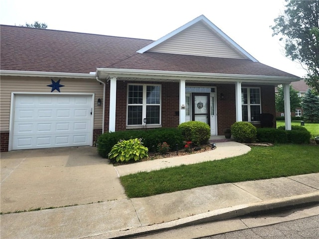 8 Courtyard Blvd, Sullivan, IL 61951 - view of front of property with an attached garage, concrete driveway, and brick siding