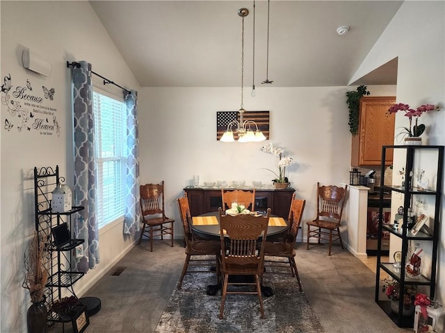 8 Courtyard Blvd, Sullivan, IL 61951 - dining area with vaulted ceiling, dark colored carpet, a chandelier, and baseboards