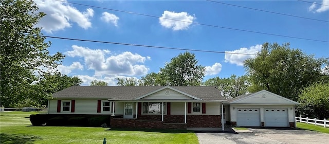 ranch-style house featuring driveway, brick siding, fence, an attached garage, and a front lawn