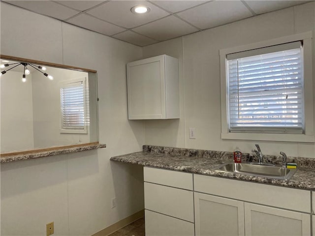 kitchen with sink and white cabinetry