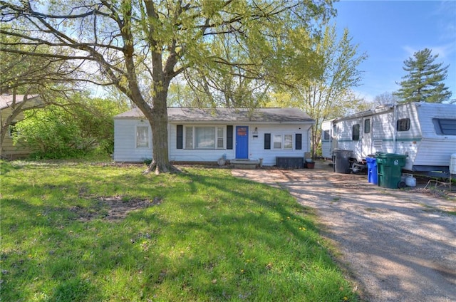 1801 Garfield Ave, Decatur, IL 62526 - ranch-style home with driveway and a front yard