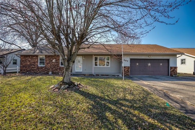 ranch-style home with a front lawn, an attached garage, and driveway