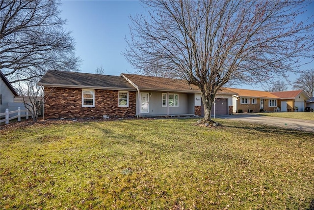 single story home featuring driveway, a front yard, a garage, and fence