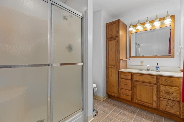 bathroom with a shower stall, vanity, and toilet