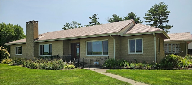 ranch-style house with a front yard