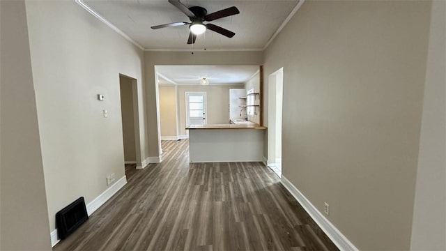 hall featuring dark hardwood / wood-style floors, ornamental molding, and sink