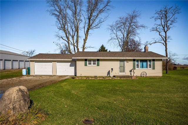 single story home with a front yard and a garage