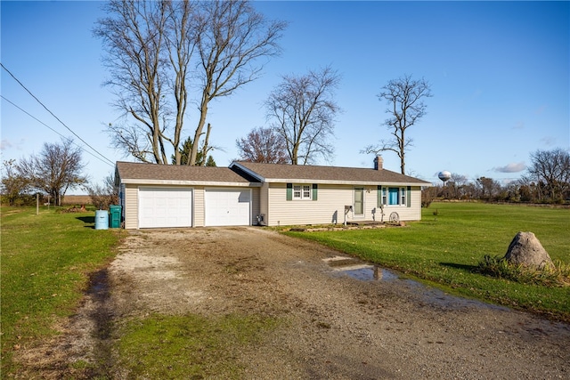 single story home featuring a front yard and a garage